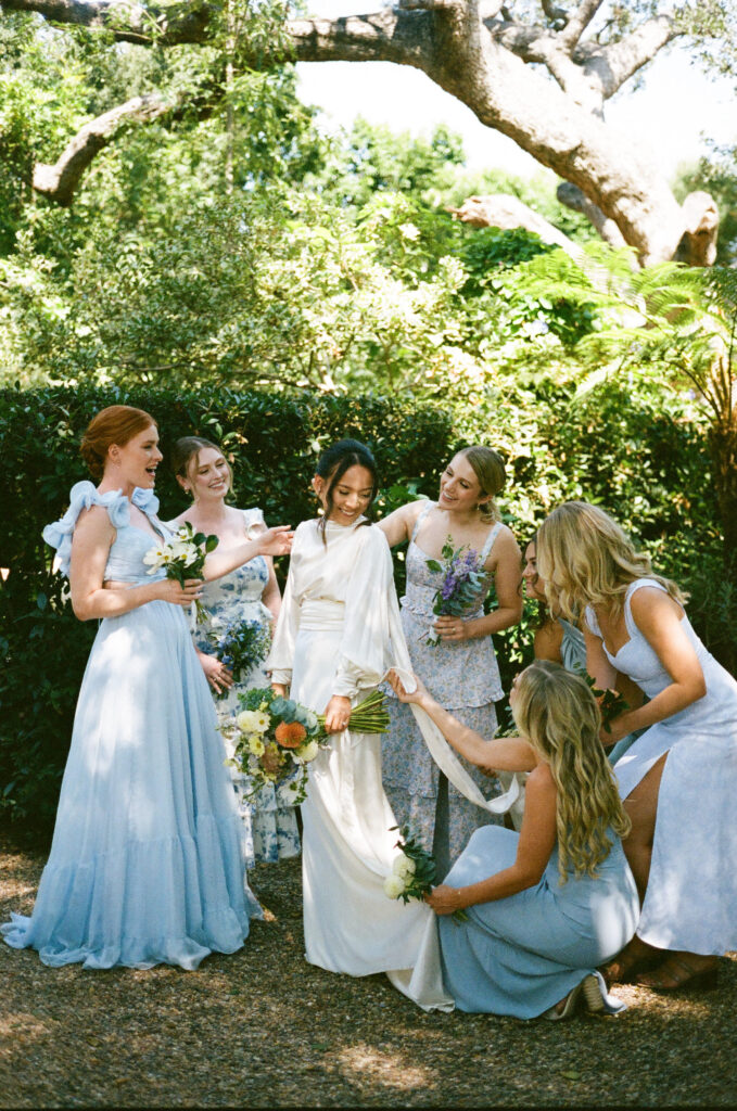 bridal party take their documentary style wedding photos outdoors