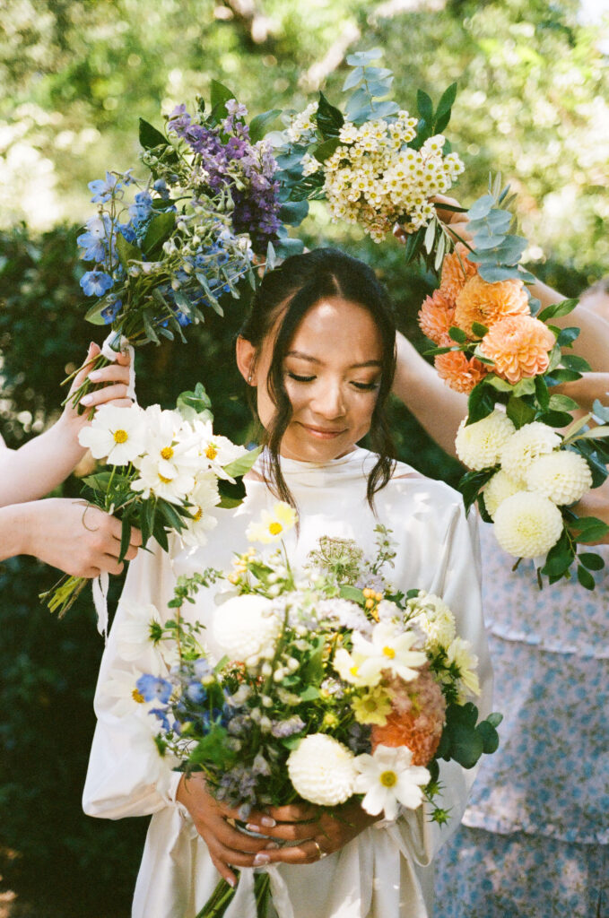 bridal party take their documentary style wedding photos outdoors