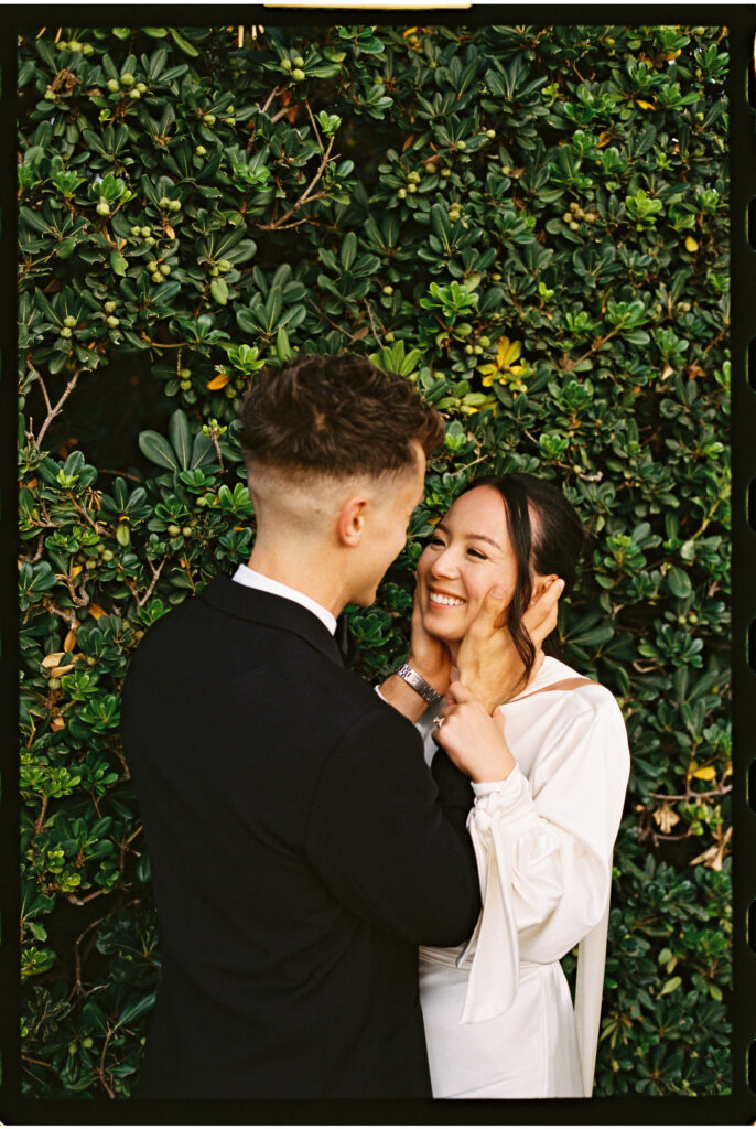 bride and groom take their documentary style wedding photos outdoors