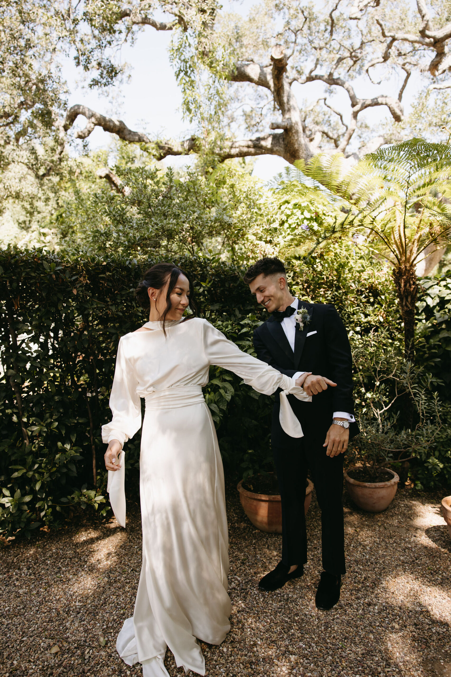 bride and groom take their documentary style wedding photos outdoors