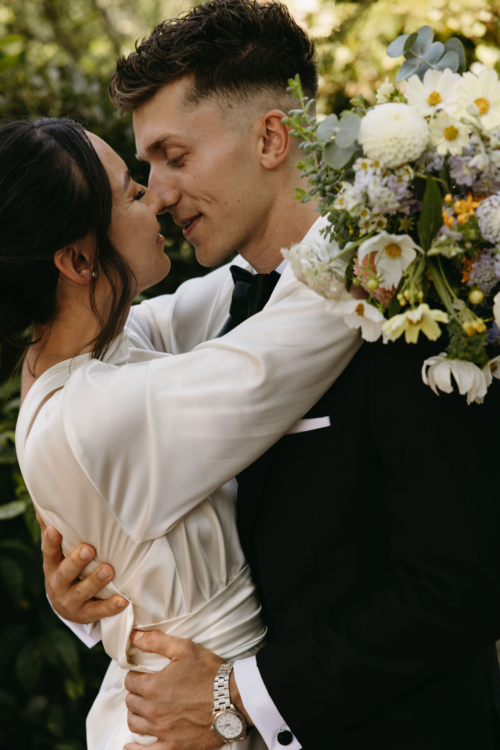 bride and groom take their documentary style wedding photos  outdoors 