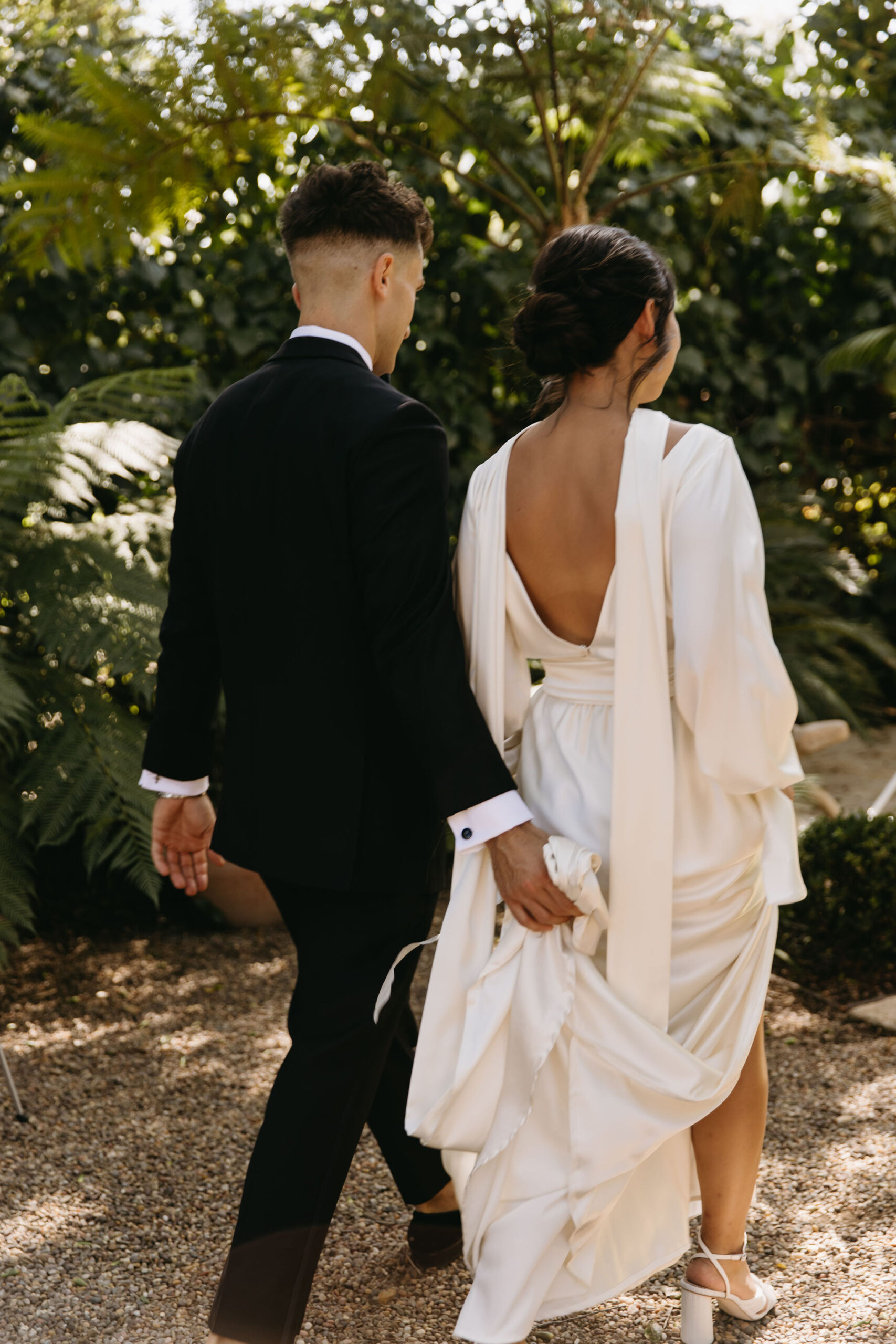 bride and groom take their documentary style wedding photos  outdoors 