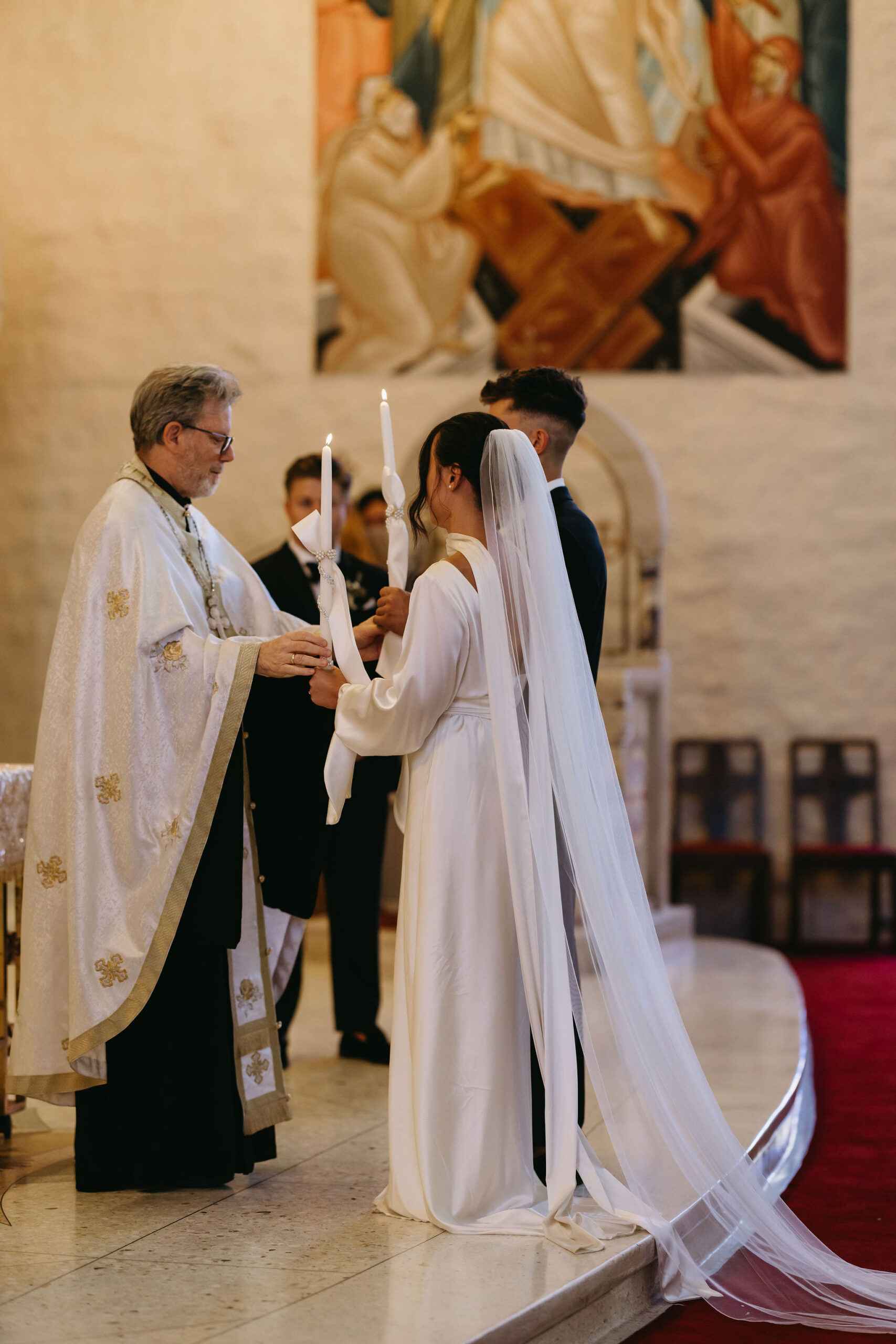 bride and groom holding candles their wedding ceremony 