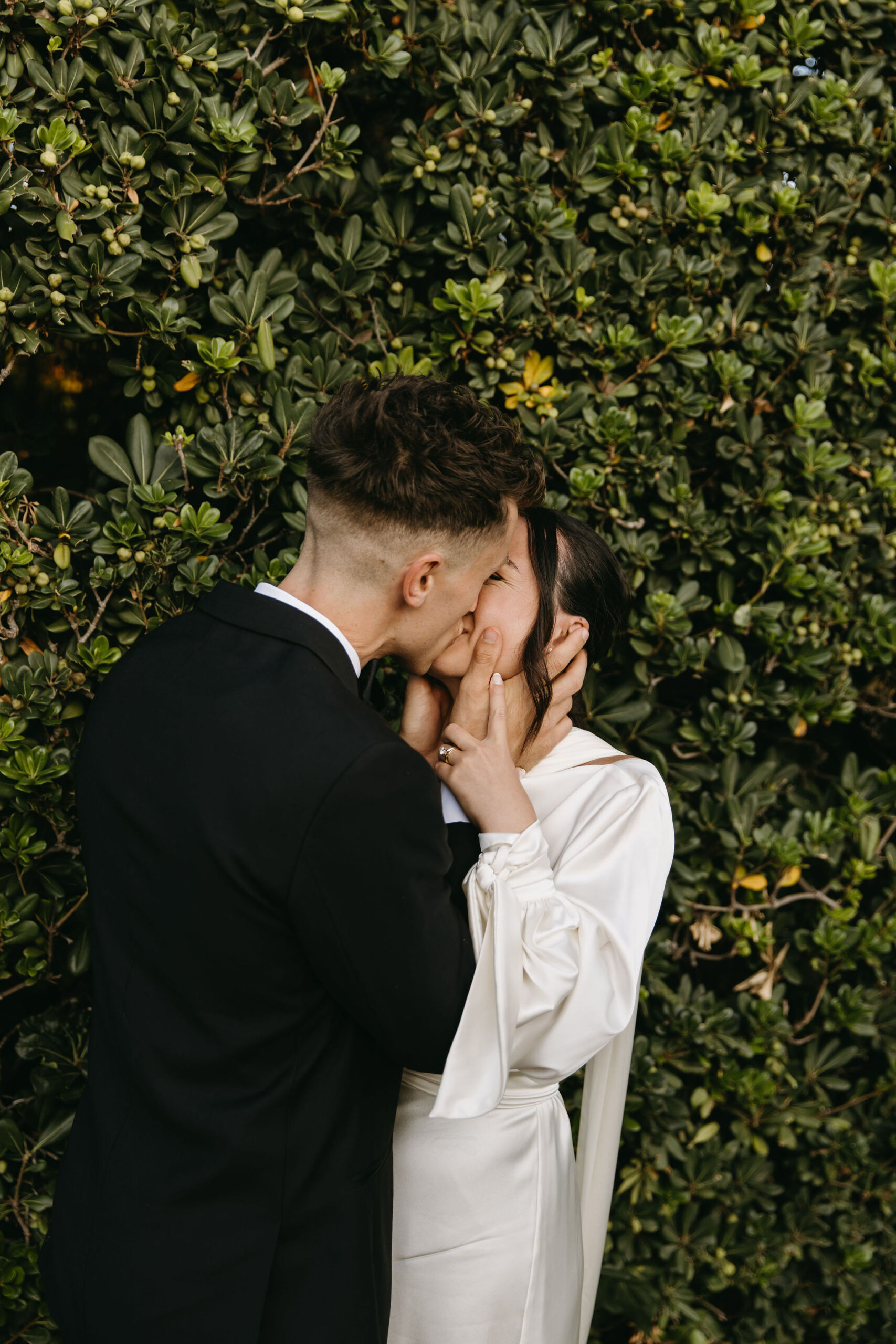 bride and groom take their documentary style wedding photos  outdoors 