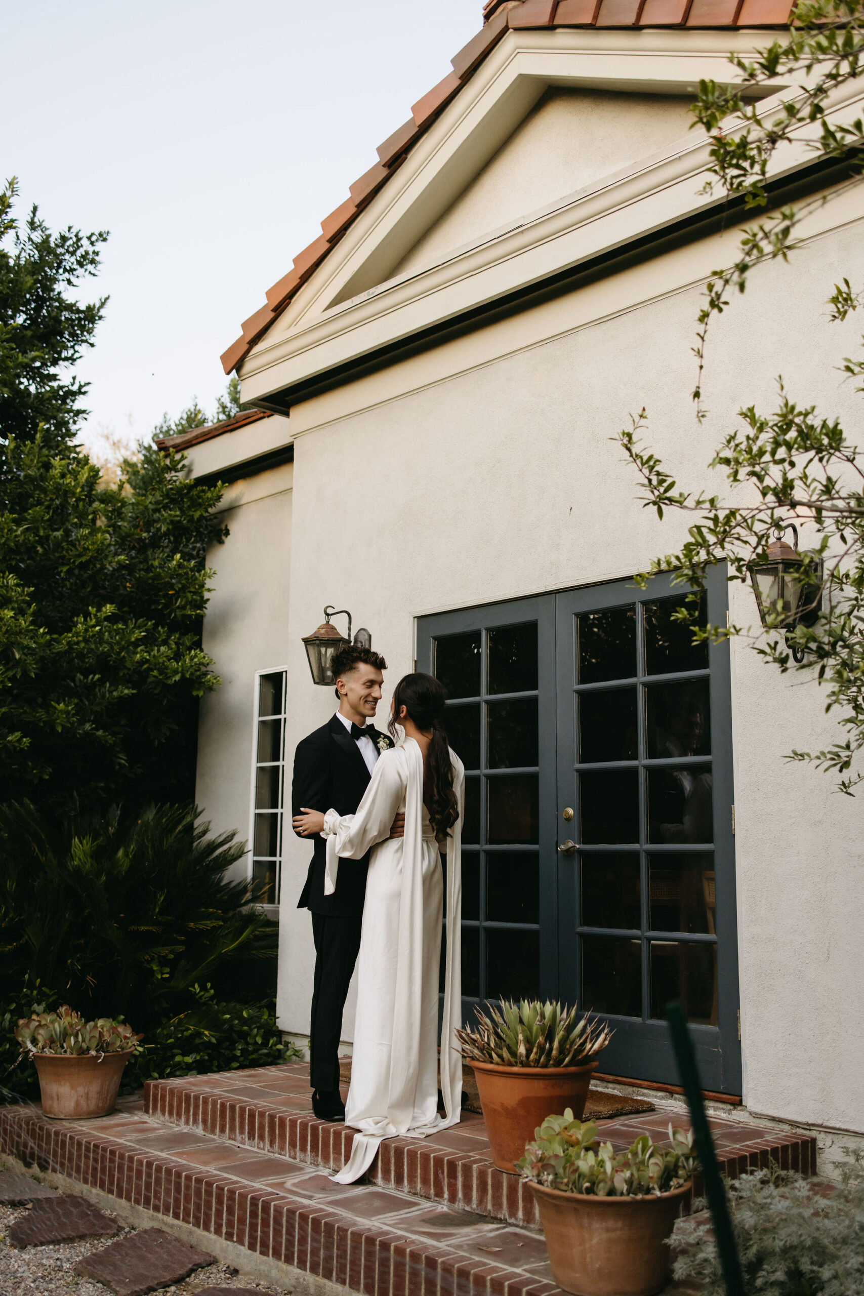 bride and groom take their documentary style wedding photos  outdoors 