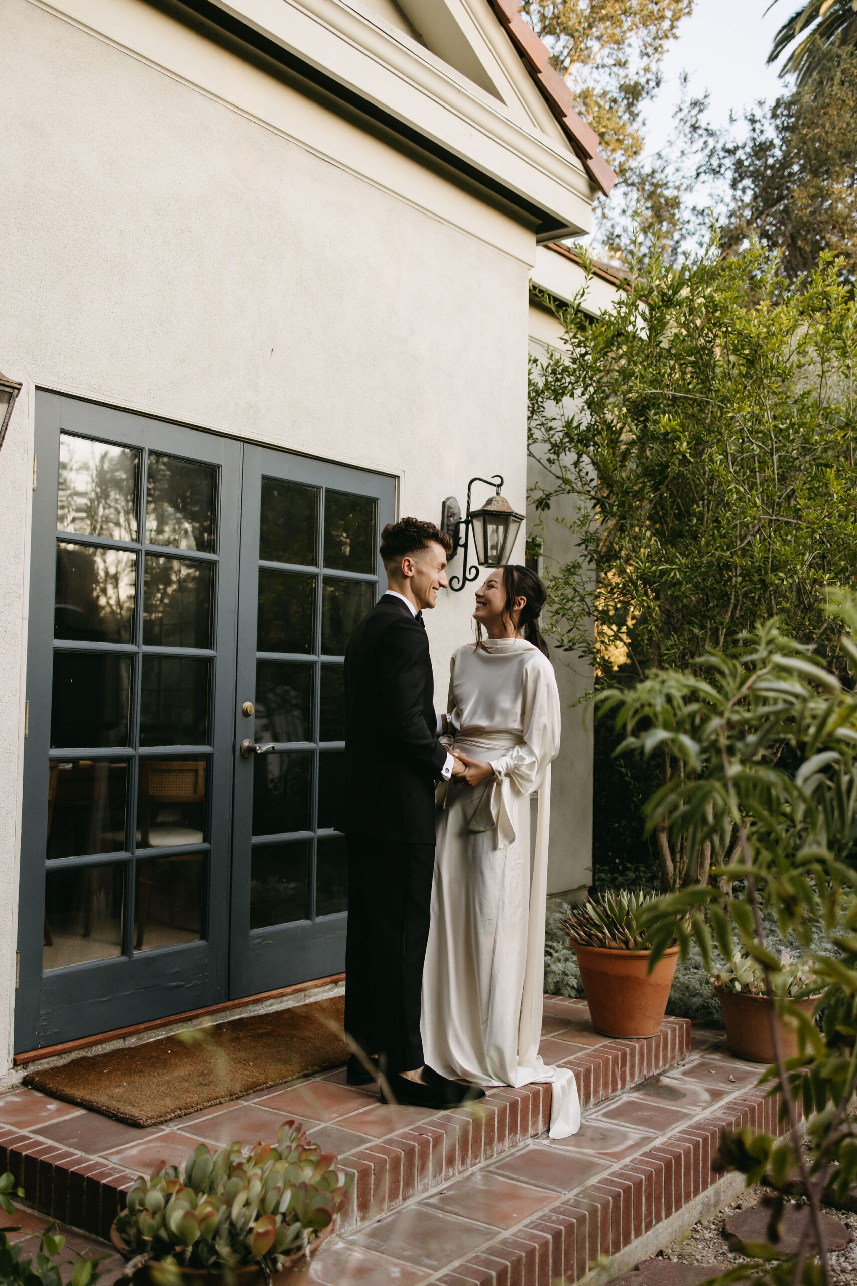 bride and groom take their documentary style wedding photos  outdoors 