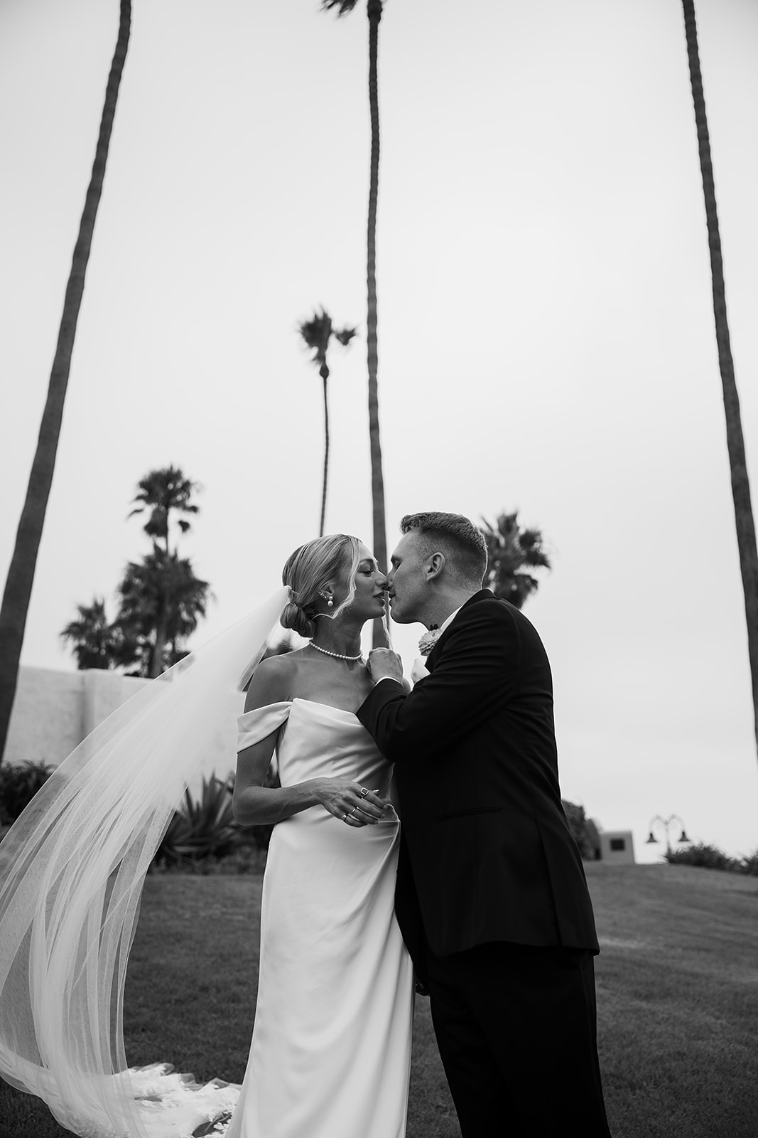 Bride and groom take wedding portraits outside their wedding venue Ole Hanson