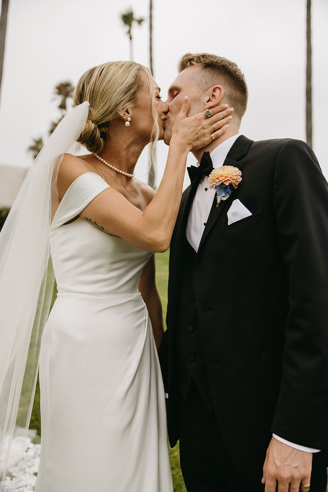 Bride and groom take wedding portraits outside their wedding venue Ole Hanson