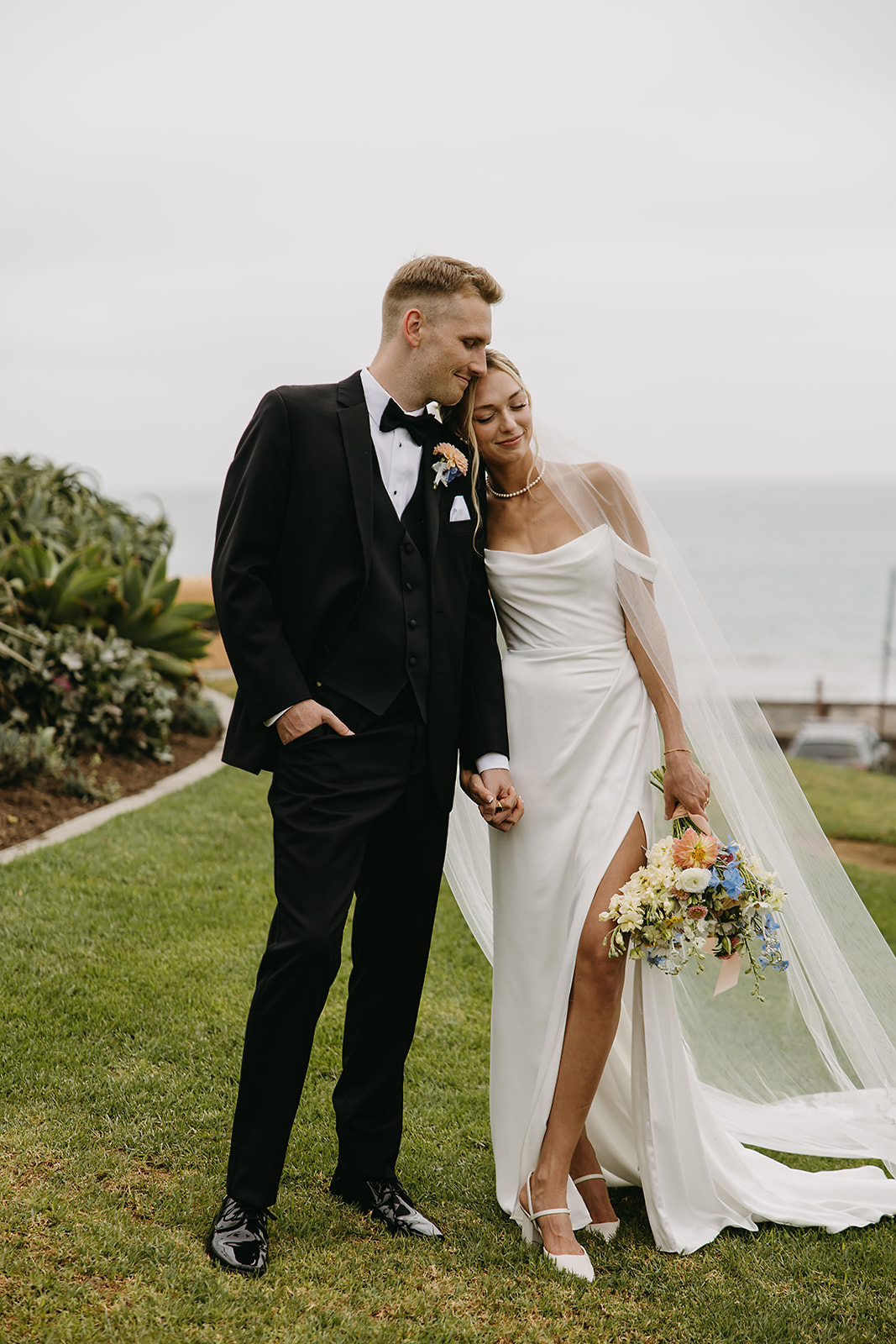 Bride and groom take wedding portraits outside their wedding venue Ole Hanson