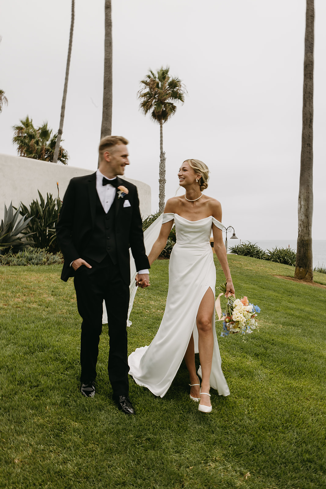 Bride and groom take wedding portraits outside their wedding venue Ole Hanson