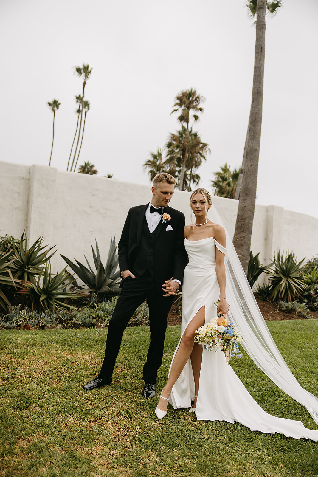 Bride and groom take wedding portraits outside their wedding venue Ole Hanson