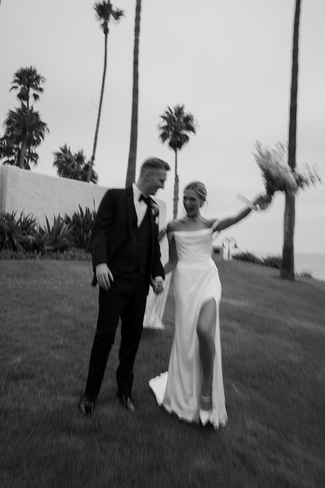 Bride and groom take wedding portraits outside their wedding venue Ole Hanson