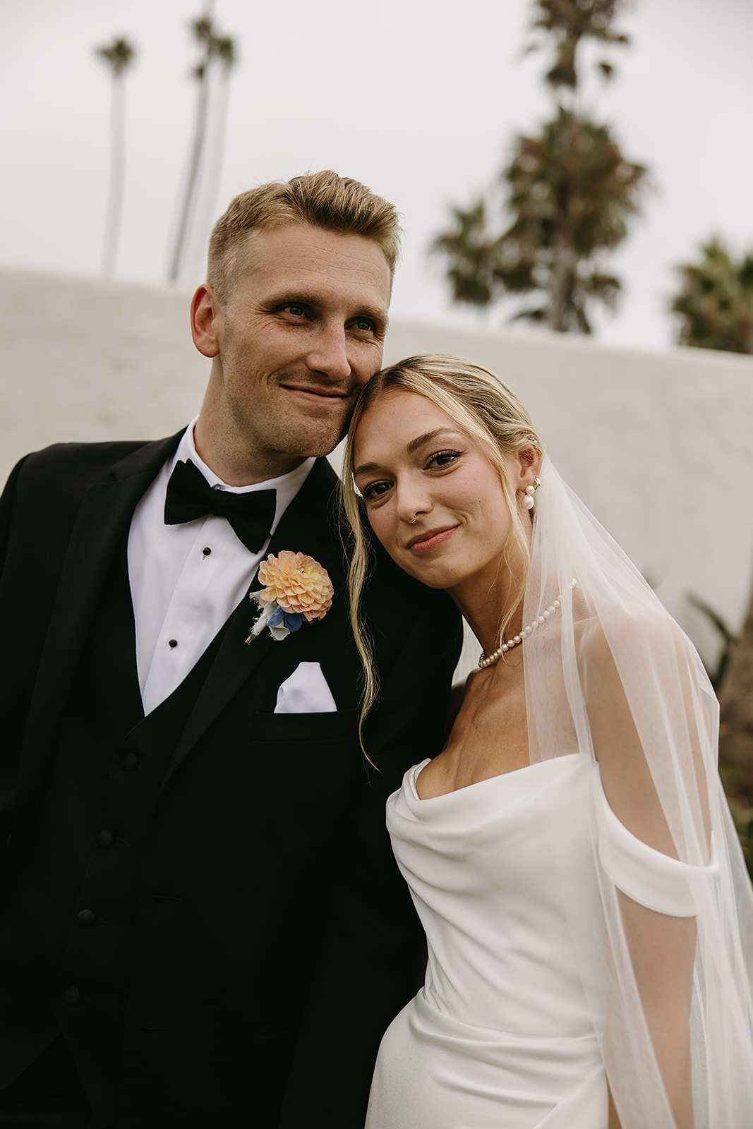 Bride and groom take wedding portraits outside their wedding venue Ole Hanson