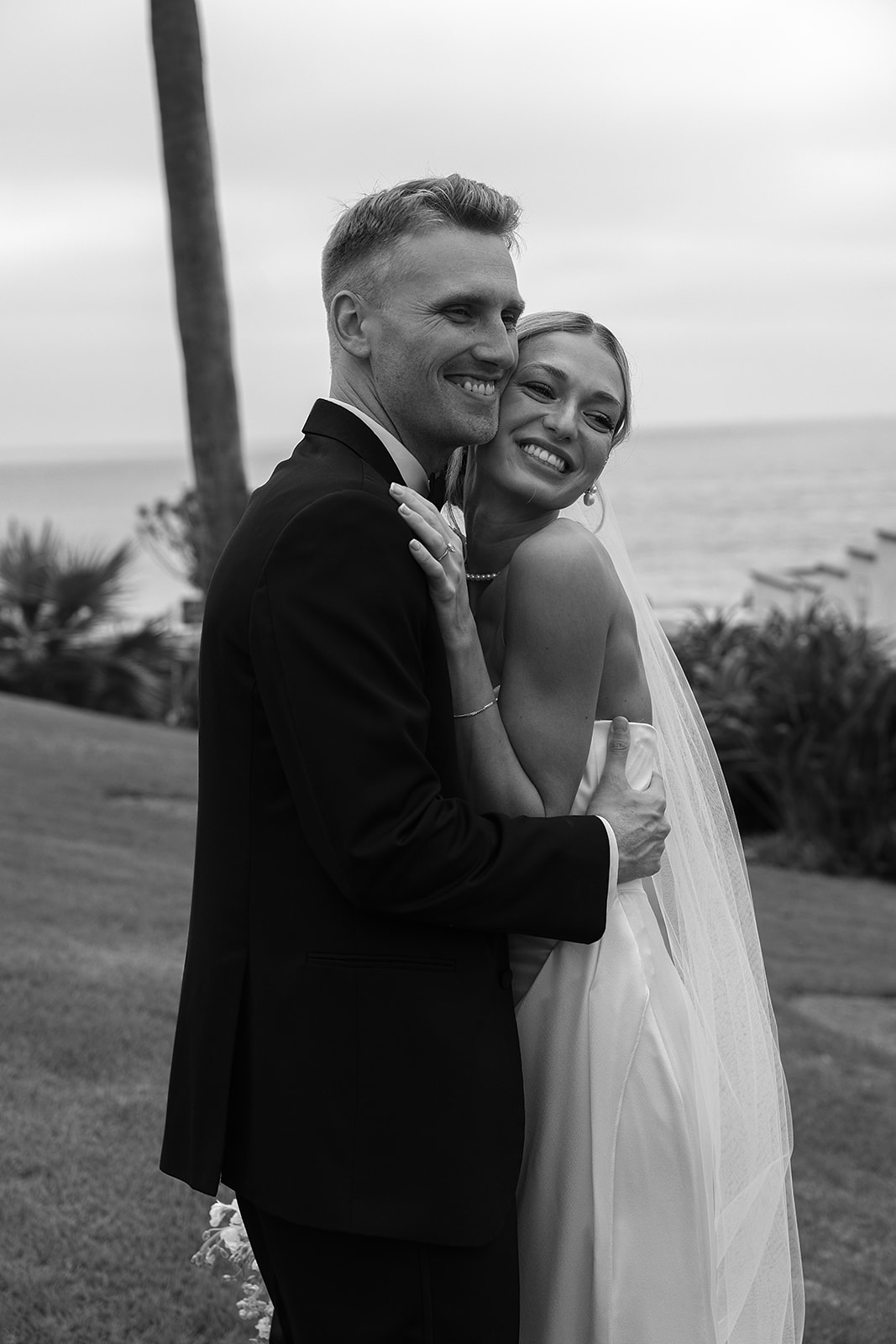 Bride and groom take wedding portraits outside their wedding venue Ole Hanson