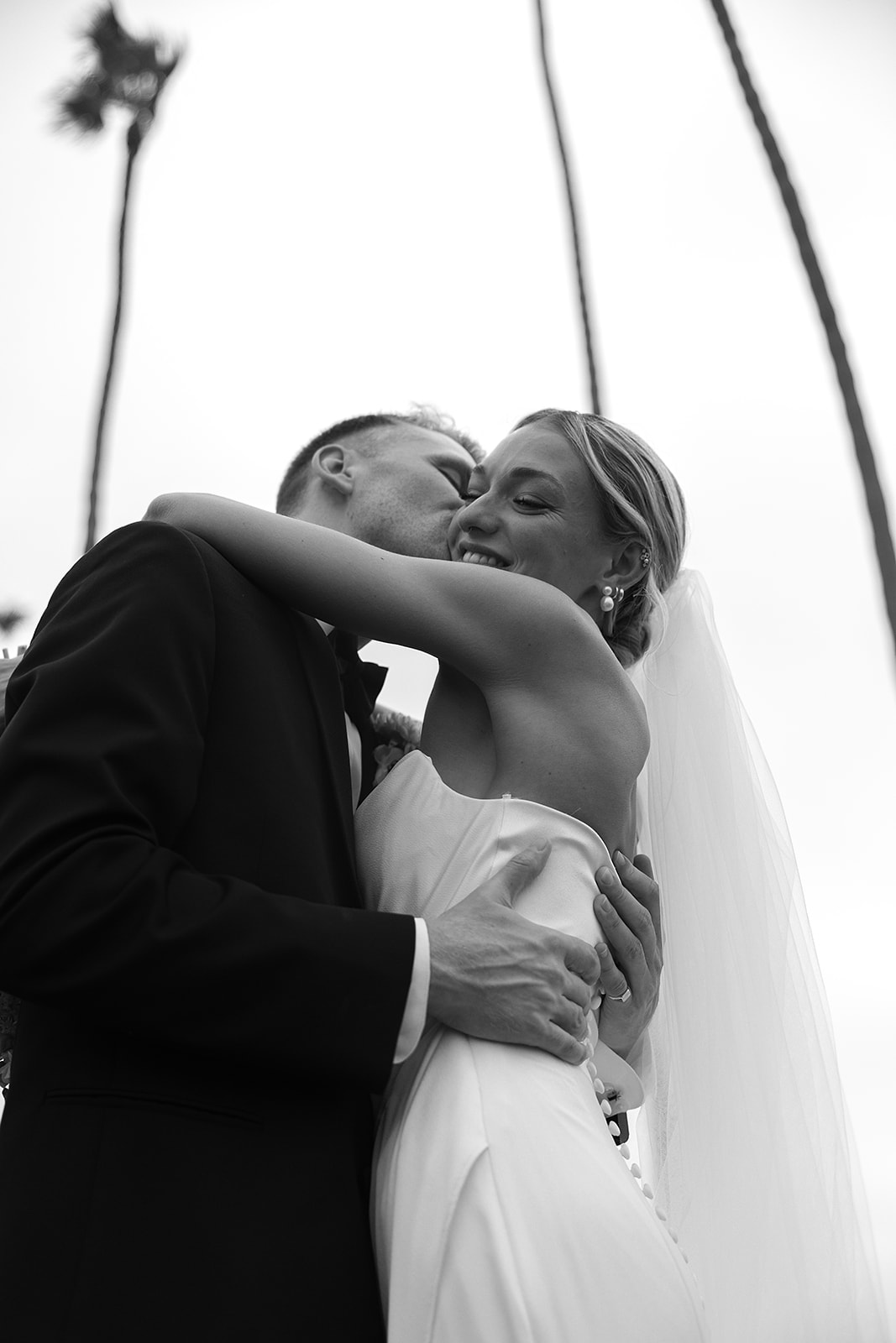 Bride and groom take wedding portraits outside their wedding venue Ole Hanson