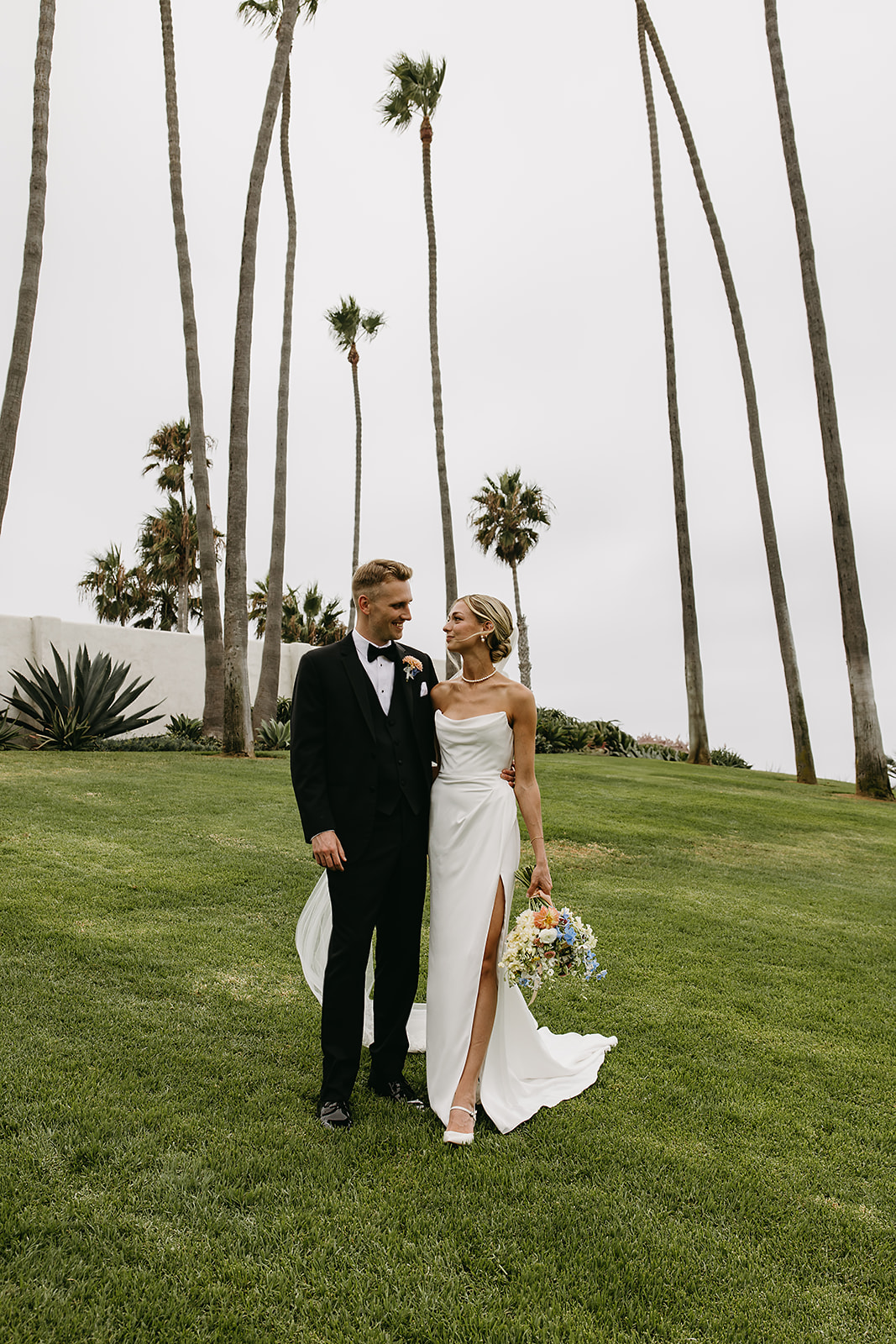 Bride and groom take wedding portraits outside their wedding venue Ole Hanson