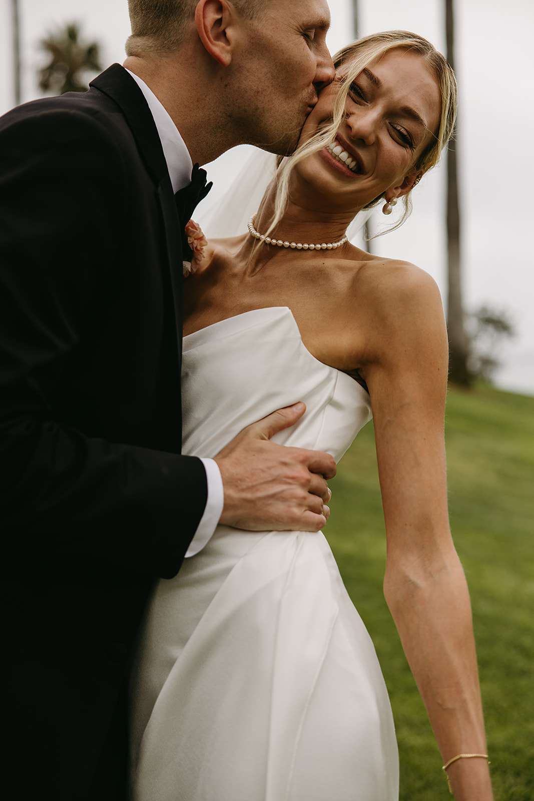 Bride and groom take wedding portraits outside their wedding venue Ole Hanson