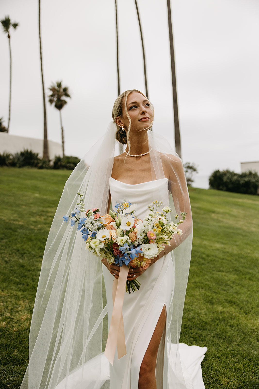 Bride and groom take wedding portraits outside their wedding venue Ole Hanson