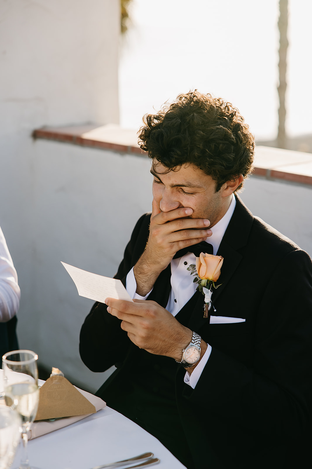 People reading hand written letters from the bride and groom at a wedding reception at Ole Hanson