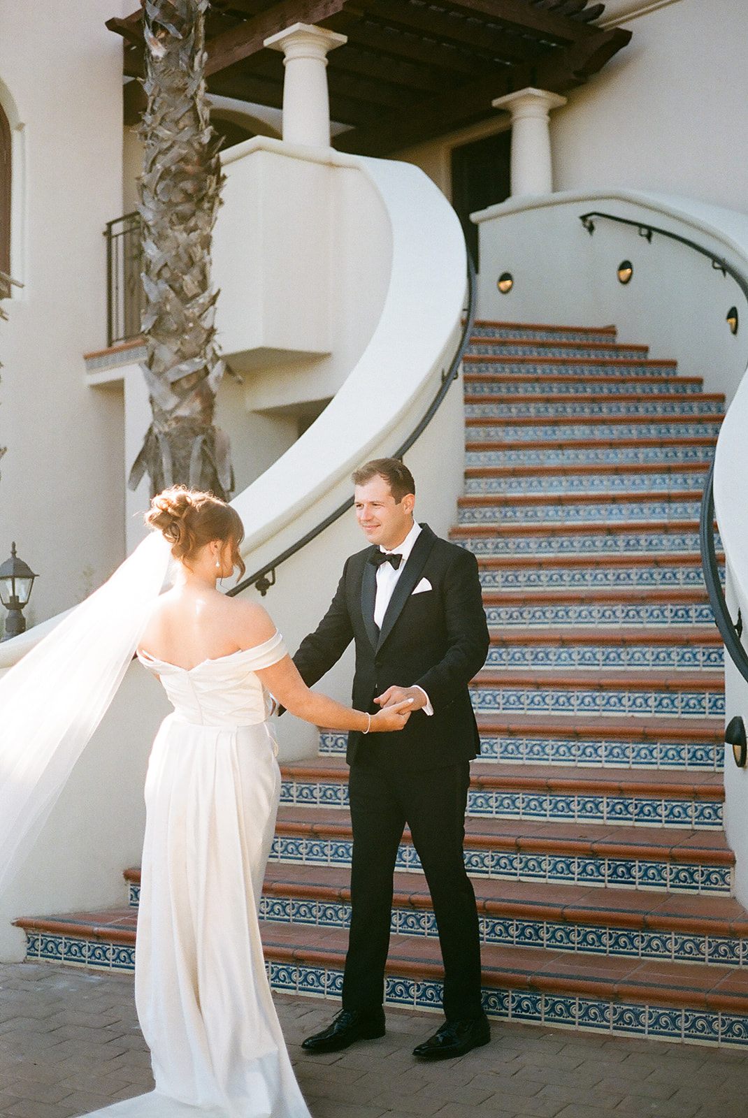 Bride and groom take wedding portraits outdoors at Ritz Carlton Bacara in Santa Barbara