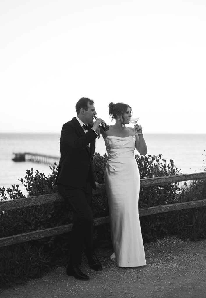 Bride and groom take wedding portraits outdoors at Ritz Carlton Bacara in Santa Barbara