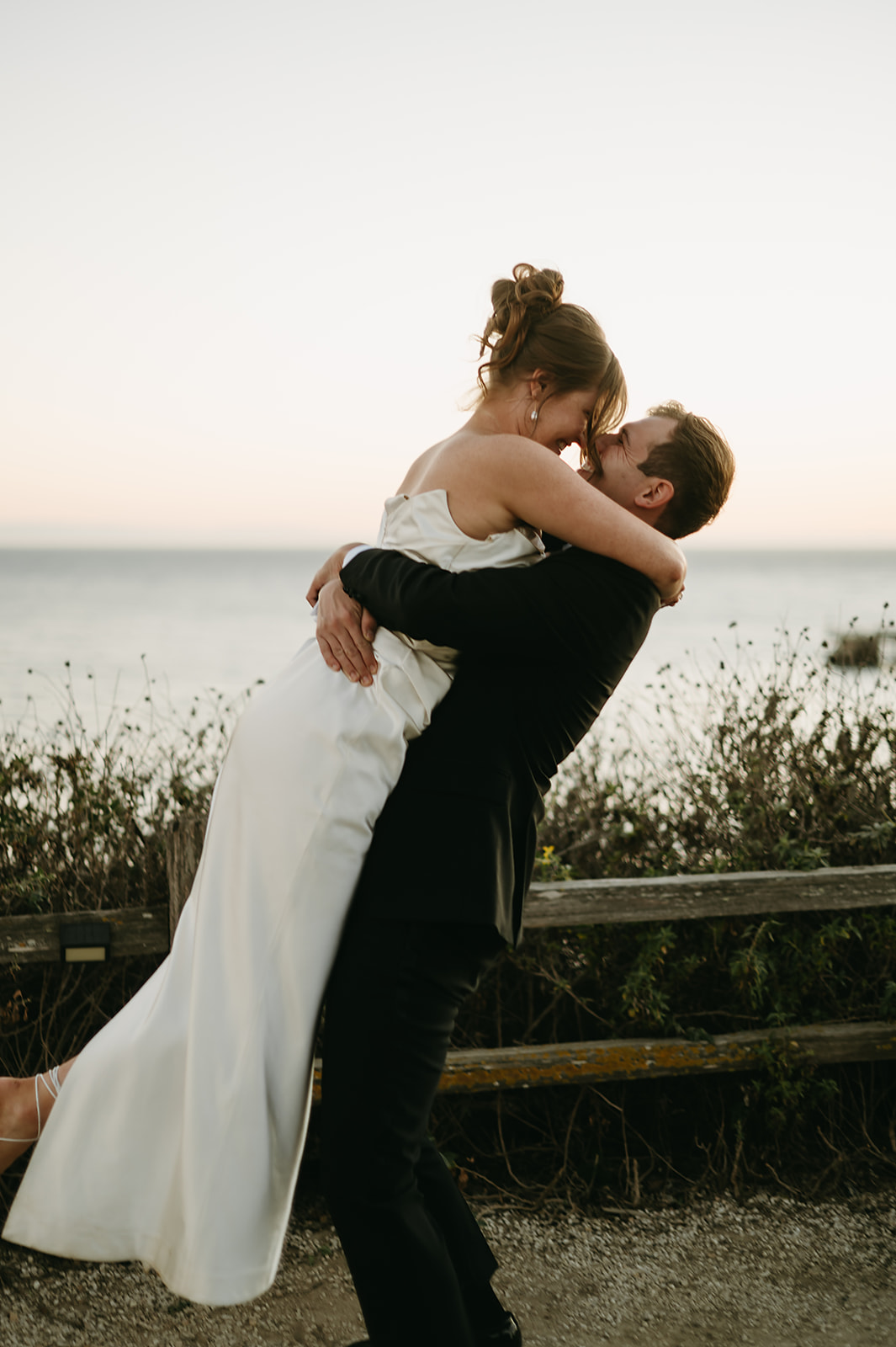 Bride and groom take wedding portraits outdoors at Ritz Carlton Bacara in Santa Barbara