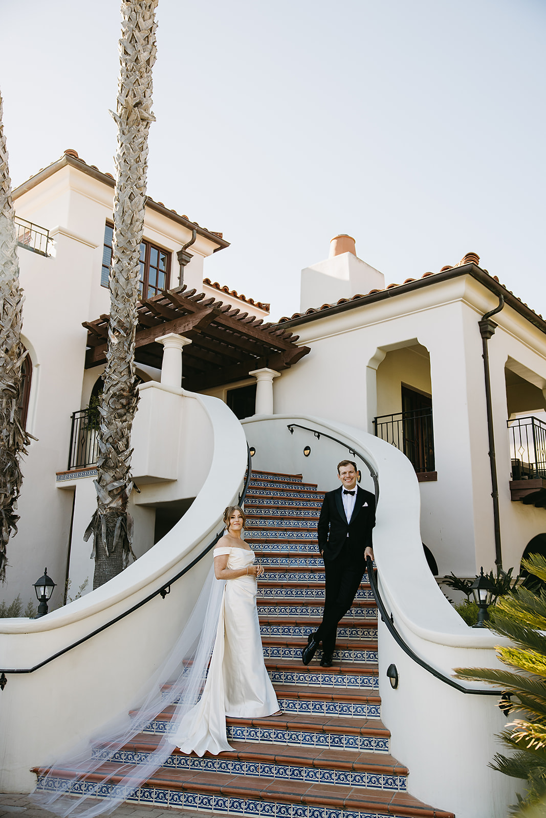 Bride and groom take wedding portraits outdoors at Ritz Carlton Bacara in Santa Barbara