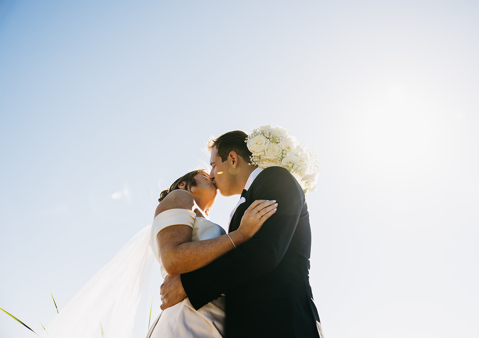 Bride and groom take wedding portraits outdoors at Ritz Carlton Bacara in Santa Barbara