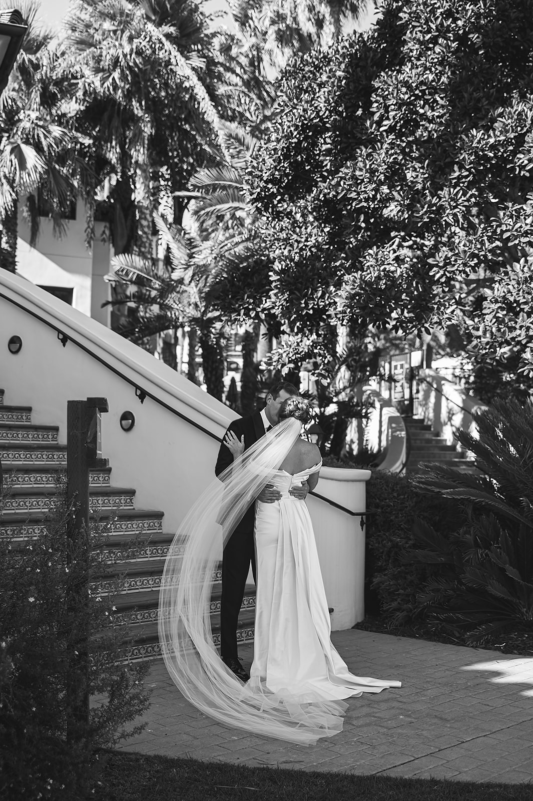 Bride and groom take wedding portraits outdoors at Ritz Carlton Bacara in Santa Barbara