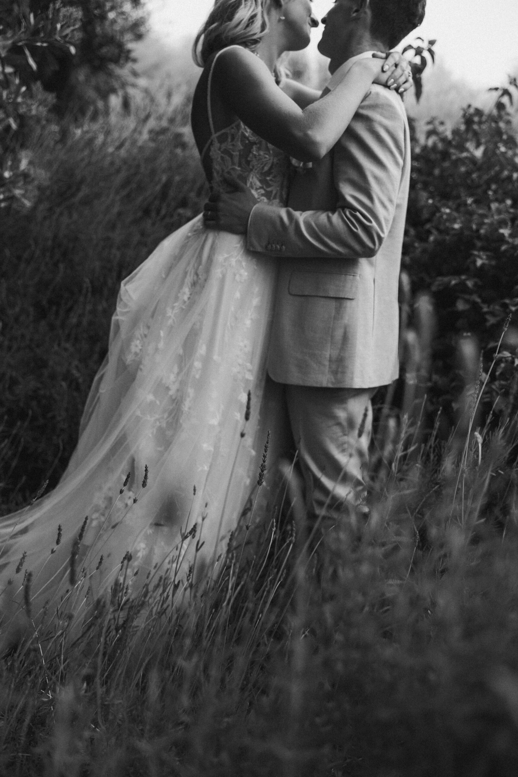 bride and groom taking portraits outdoors of their wedding venue the quail ranch in simi valley