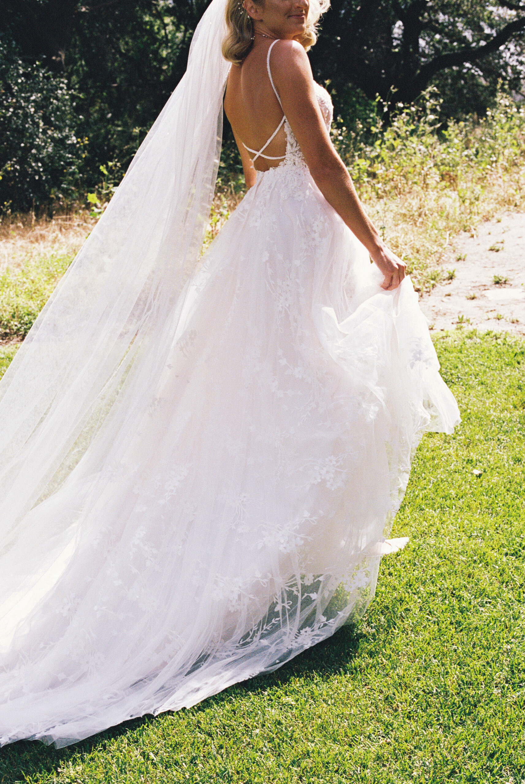 bride and groom taking portraits outdoors of their wedding venue the quail ranch in simi valley