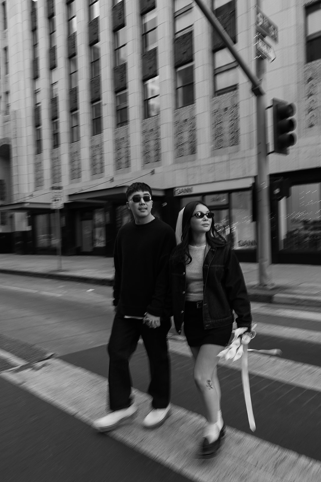 couple takes engagement photos on the street in downtown LA