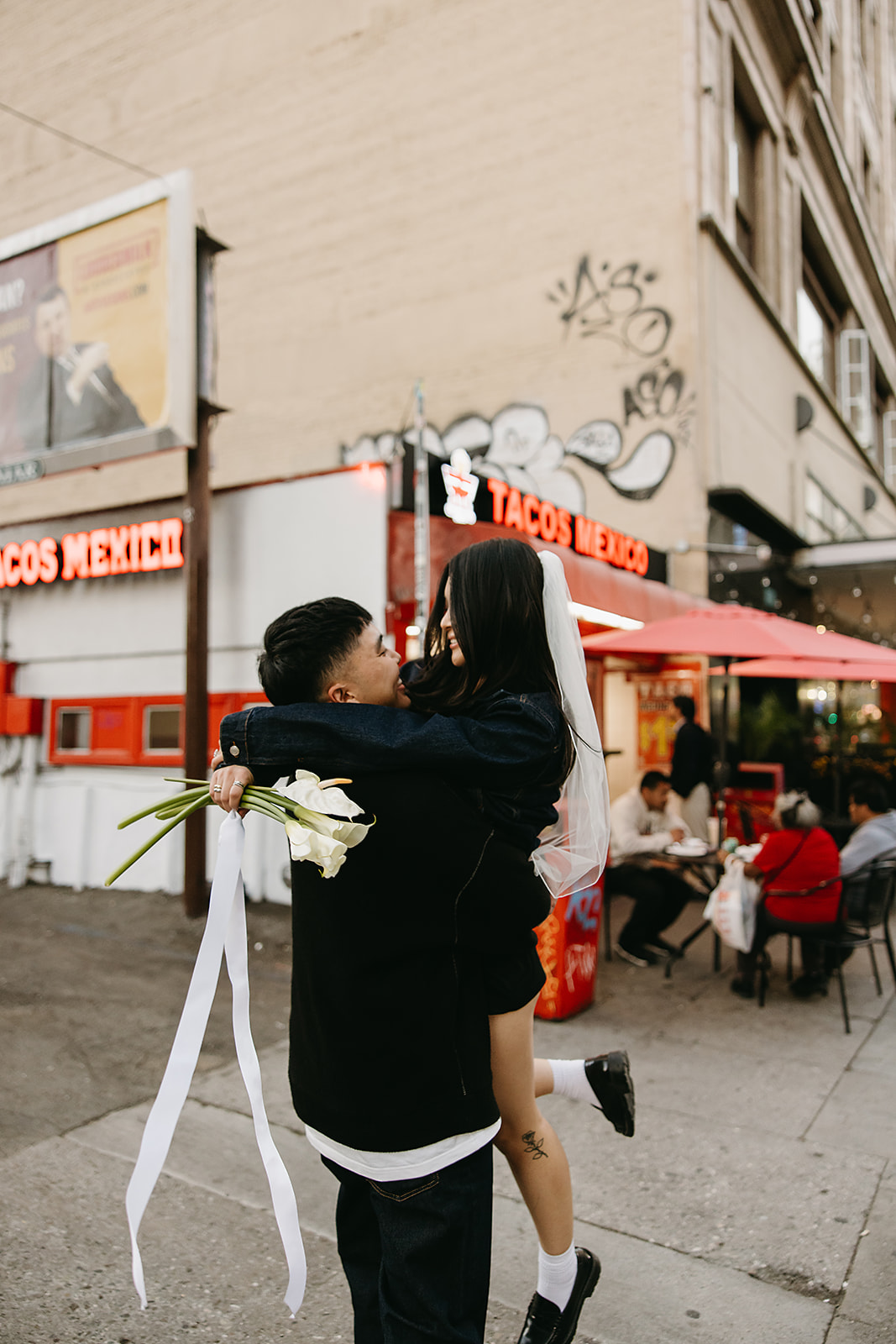 couple takes engagement photos on the street in downtown LA 