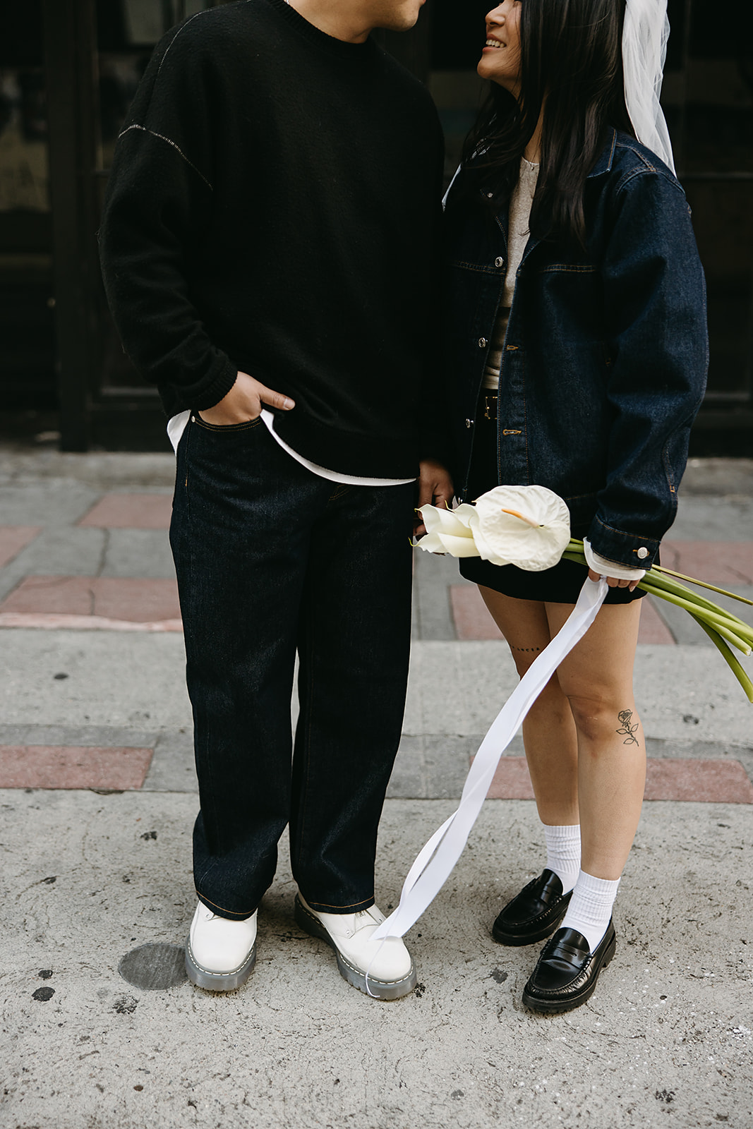 couple takes engagement photos on the street in downtown LA 