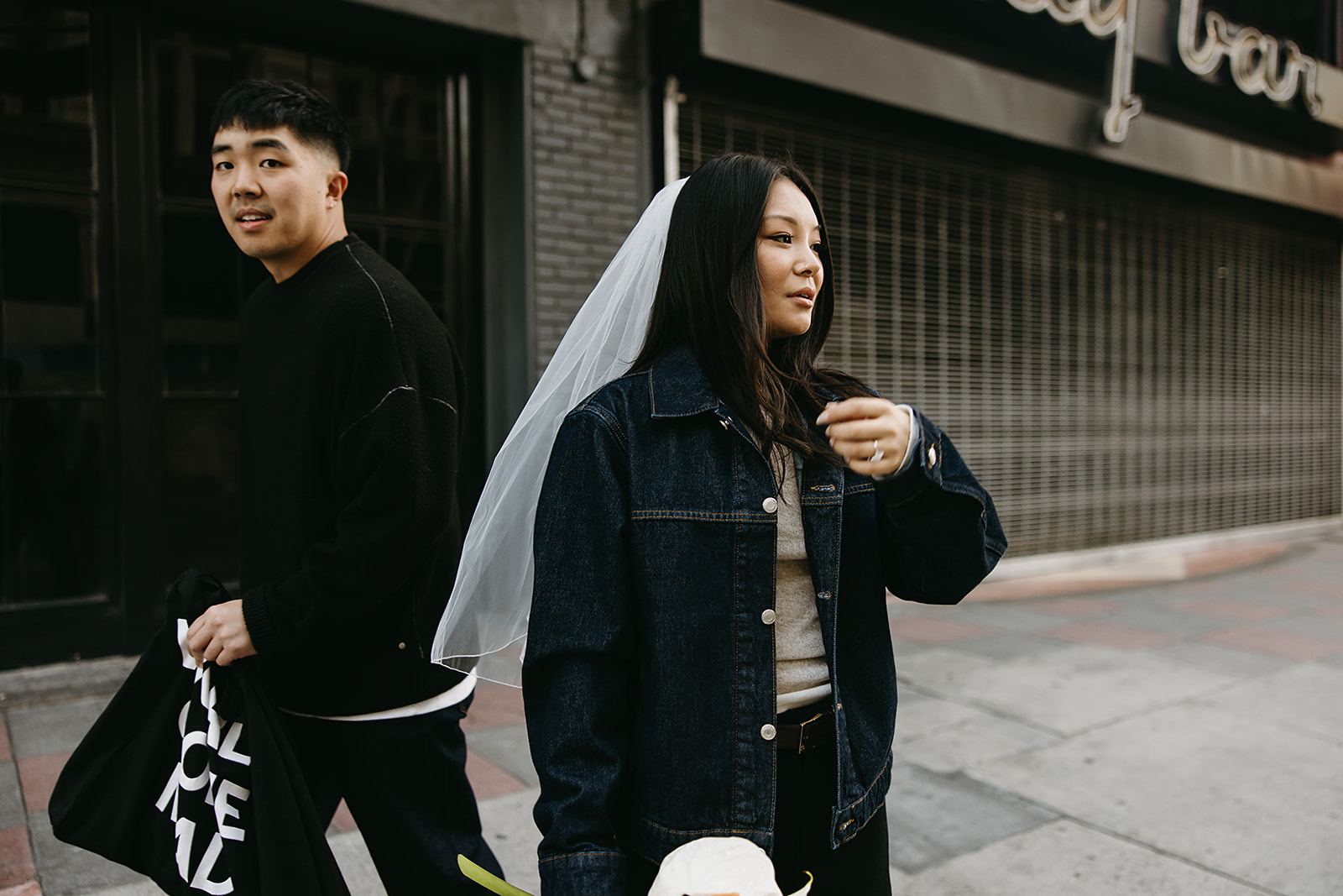 couple takes engagement photos on the street in downtown LA 