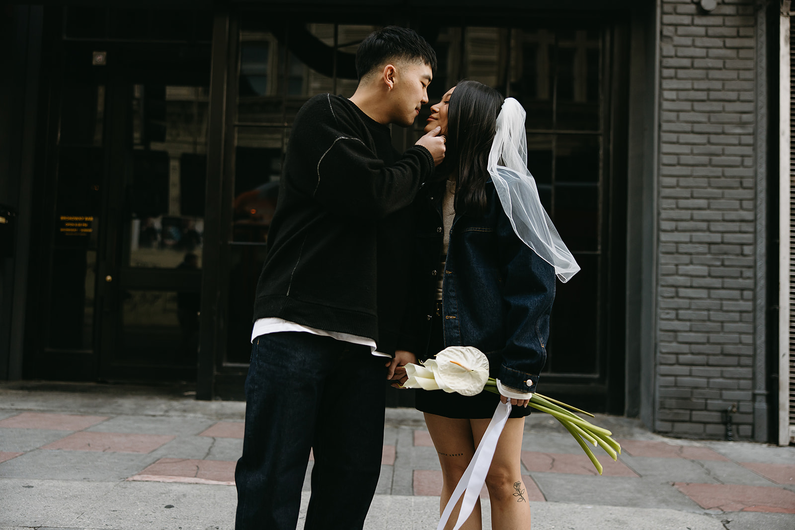 couple takes engagement photos on the street in downtown LA 