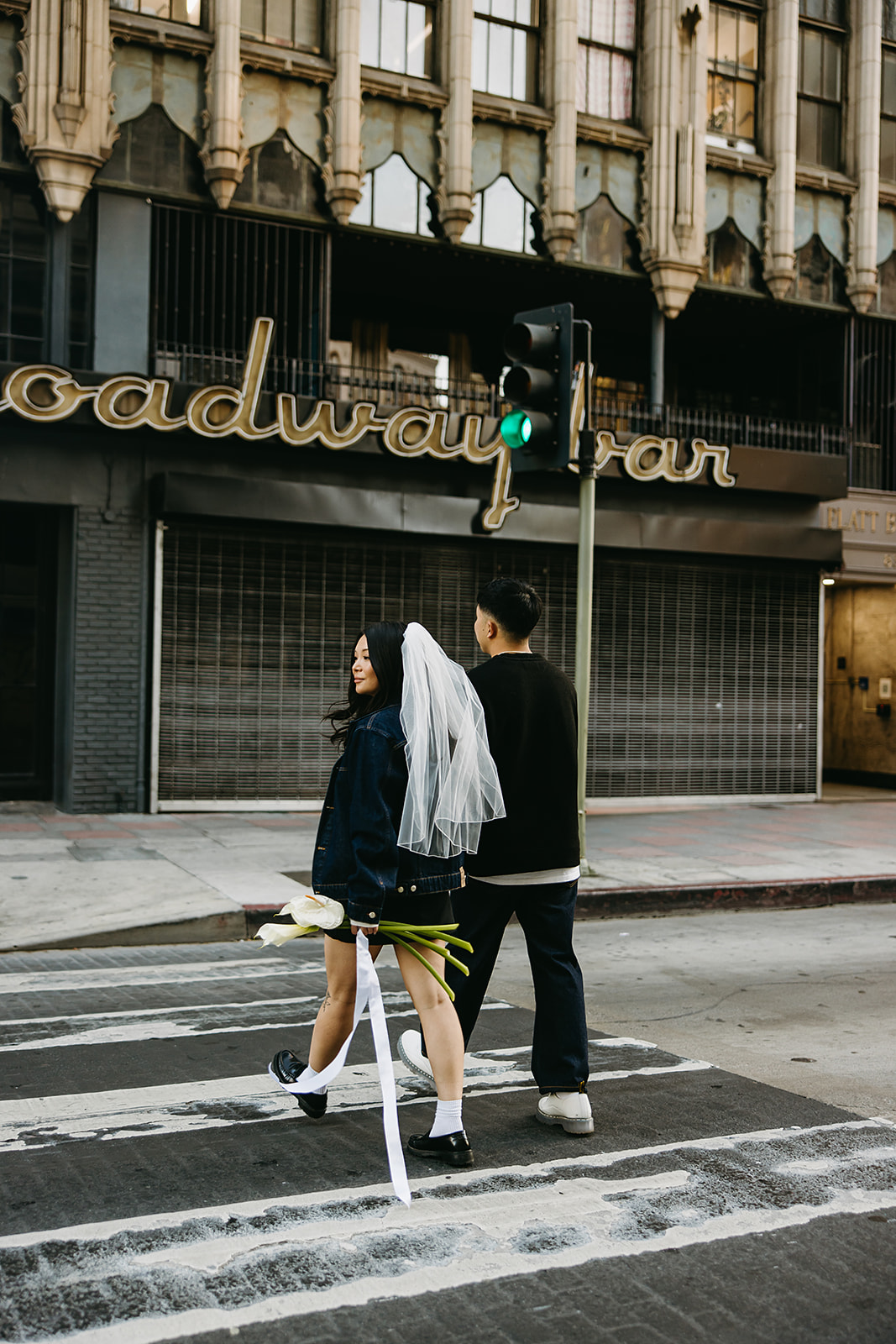 couple takes engagement photos on the street in downtown LA 