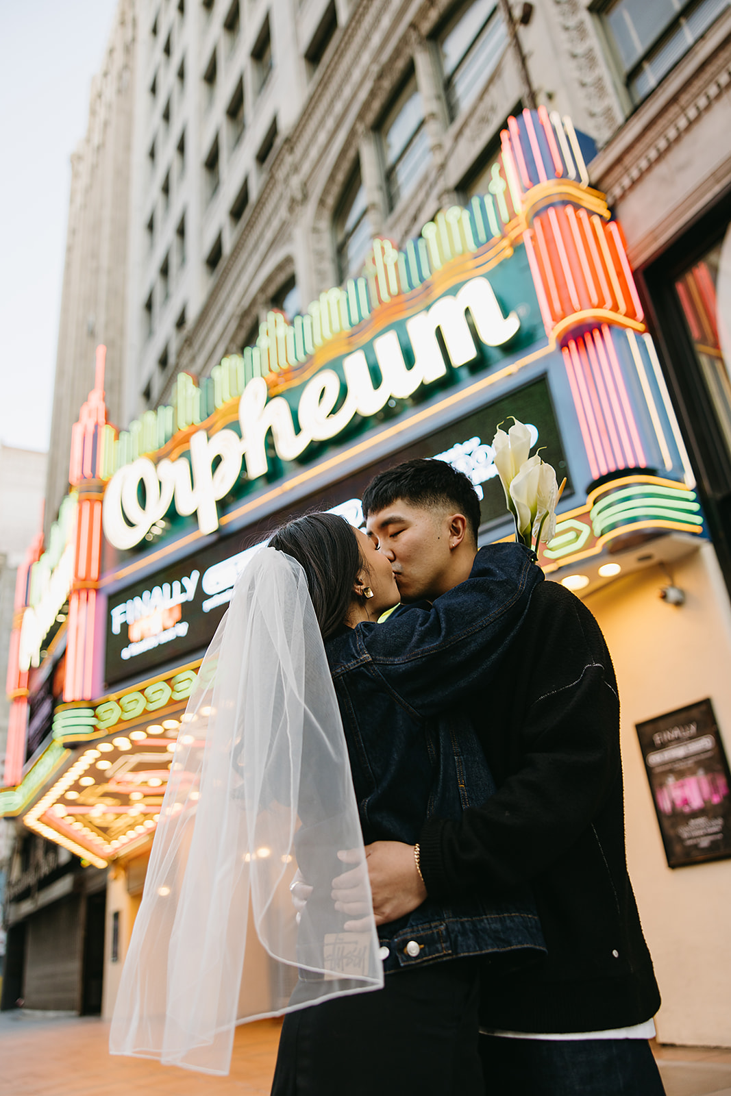 couple takes engagement photos on the street in downtown LA 