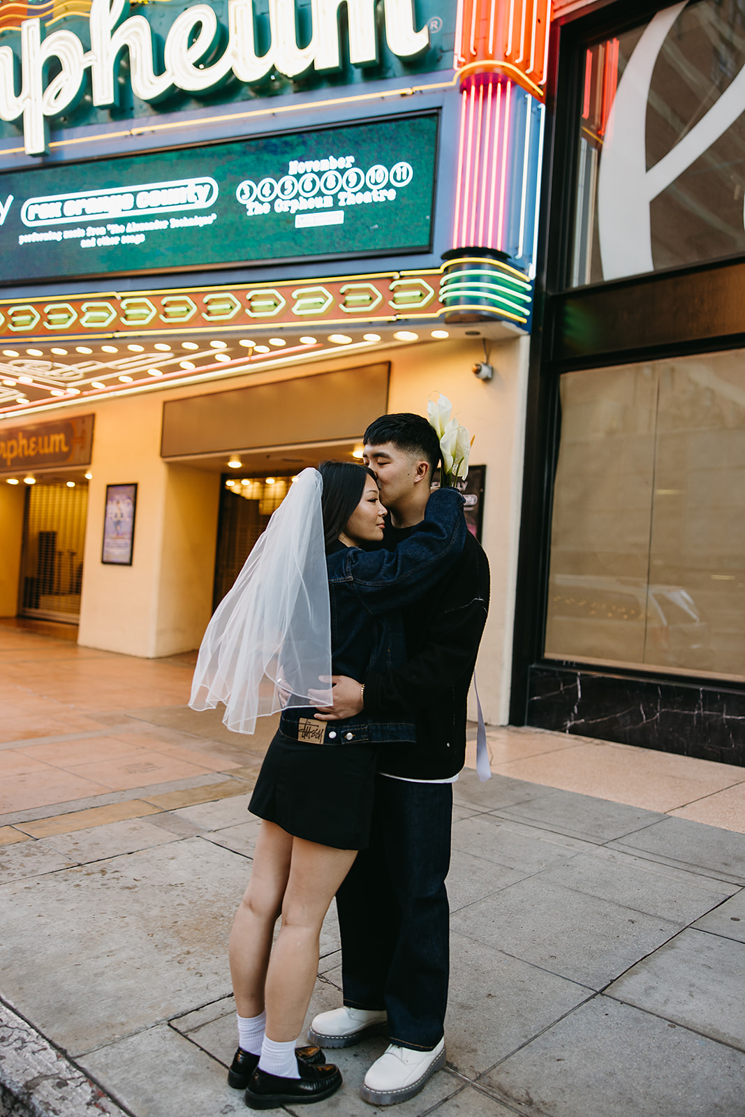 couple takes engagement photos on the street in downtown LA 