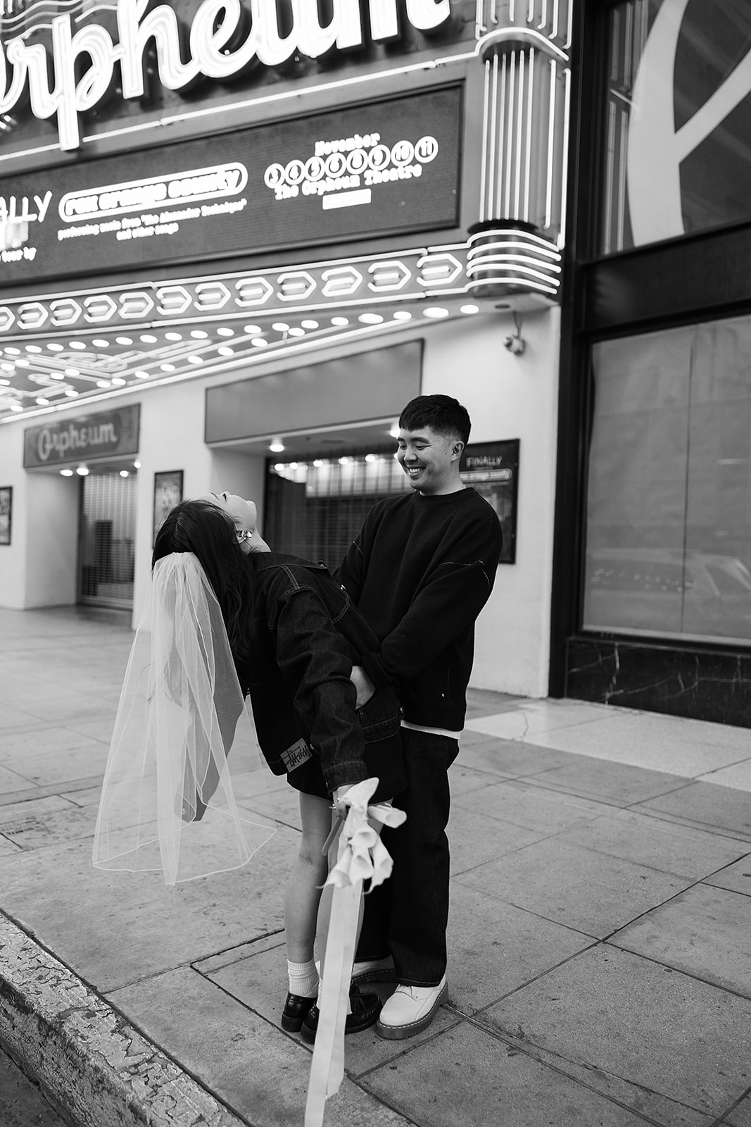 couple takes engagement photos on the street in downtown LA 