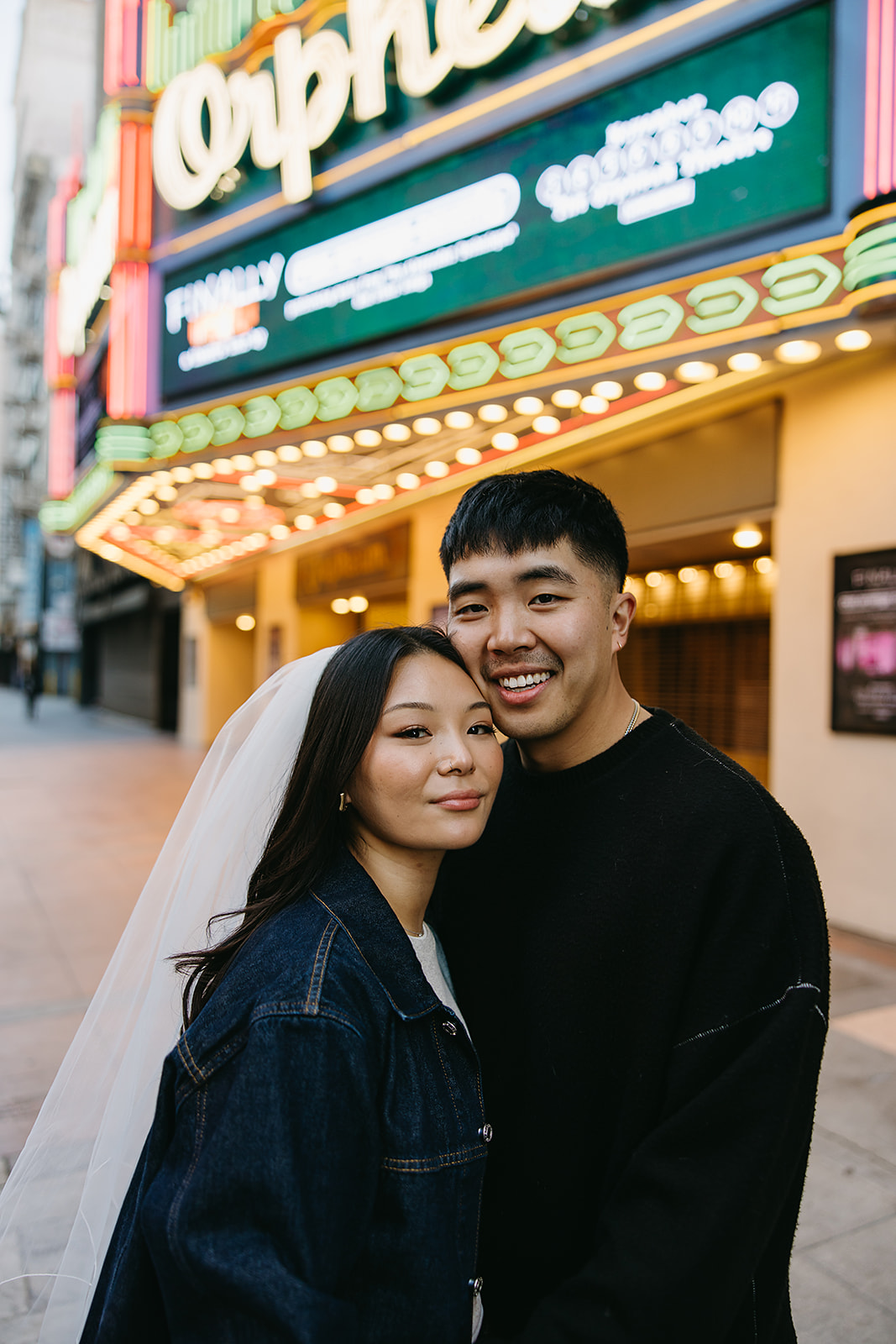 couple takes engagement photos on the street in downtown LA 