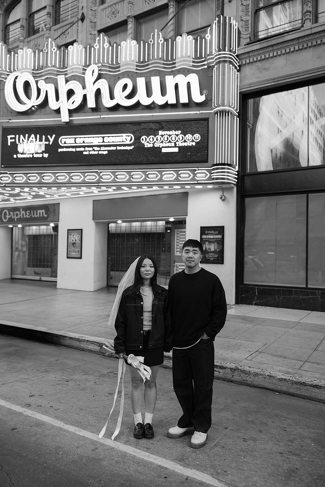 couple takes engagement photos on the street in downtown LA 