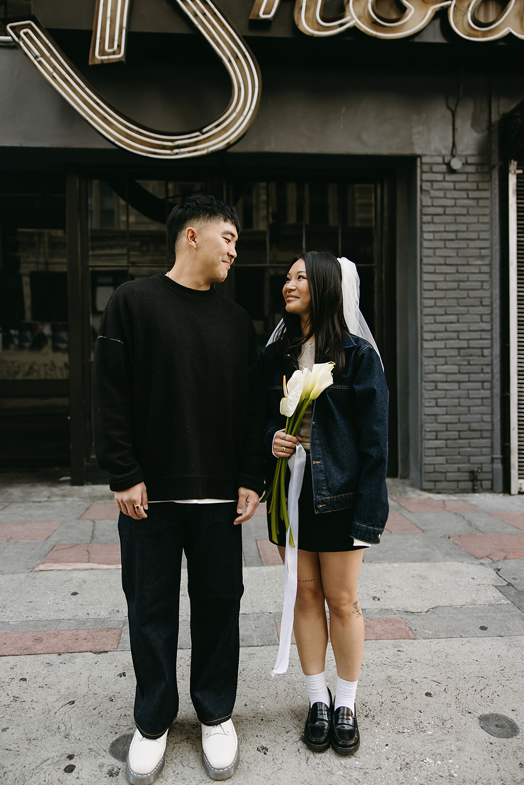 couple takes engagement photos on the street in downtown LA 