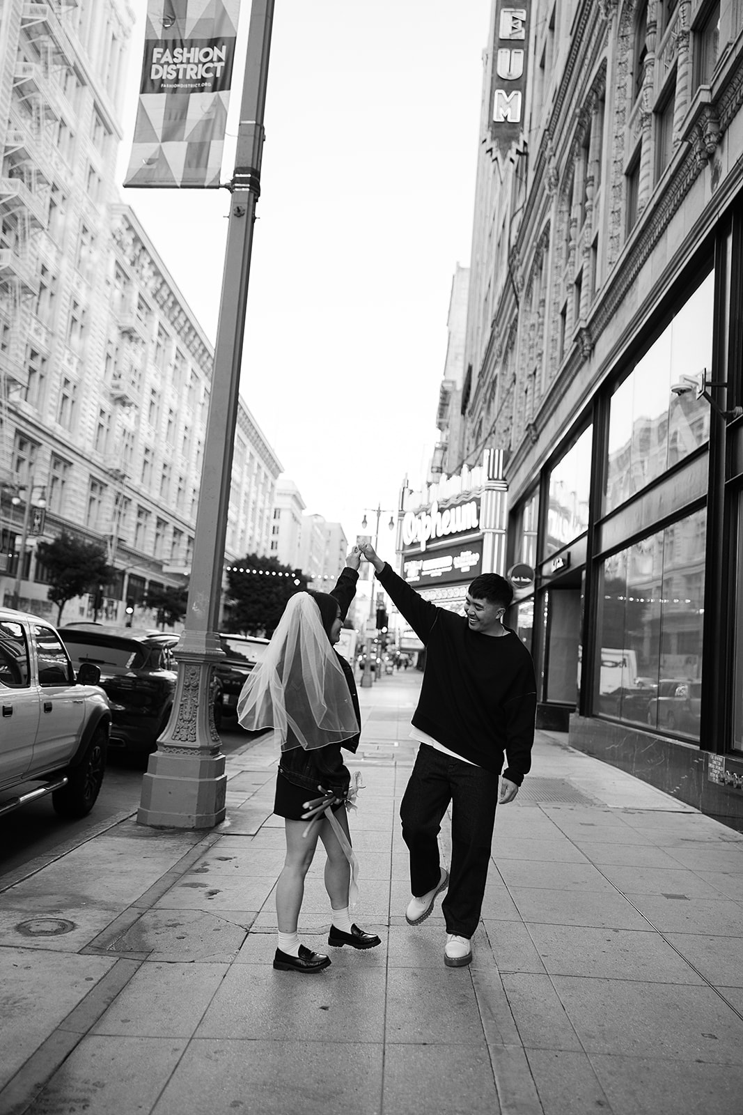 couple takes engagement photos on the street in downtown LA 