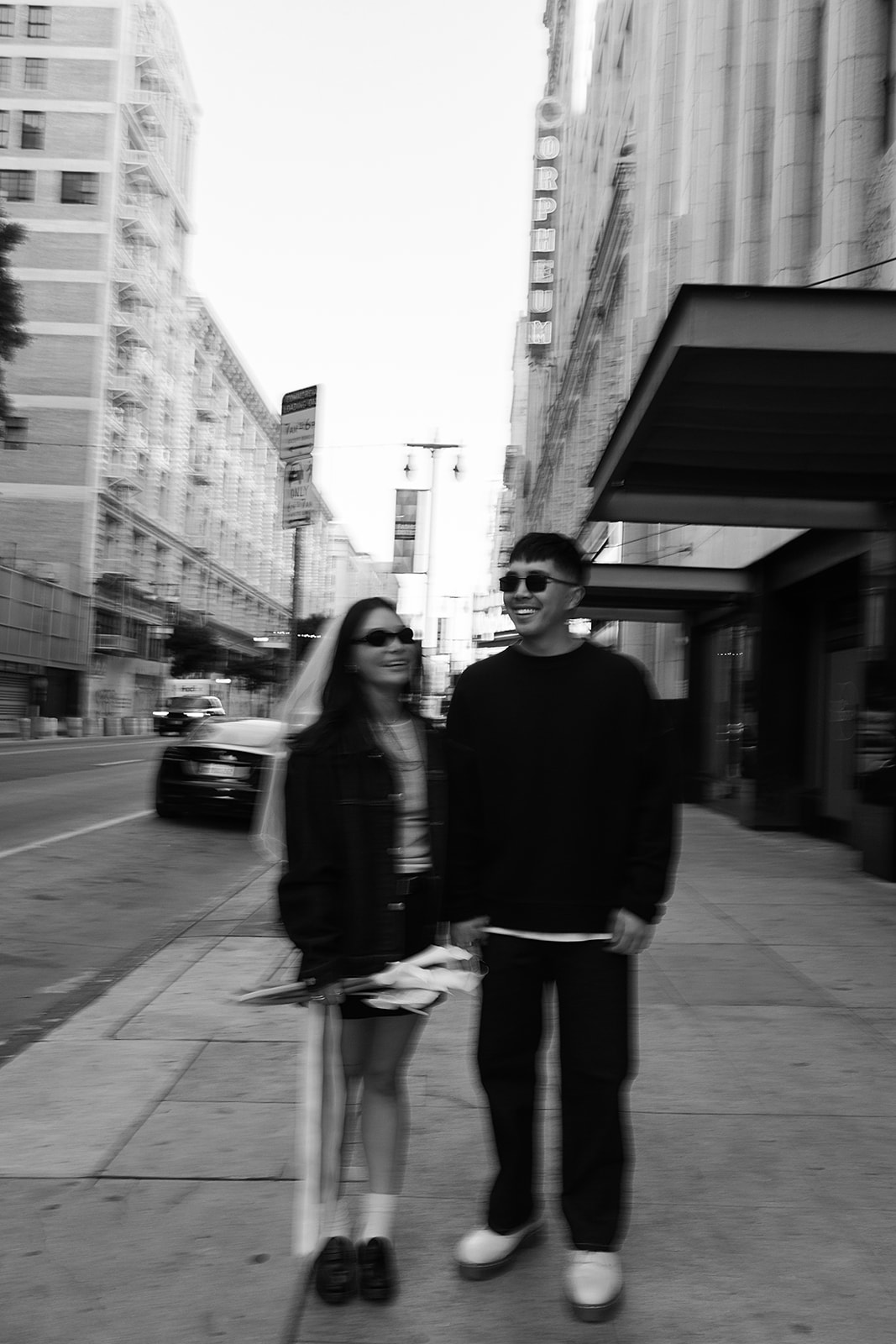 couple takes engagement photos on the street in downtown LA 