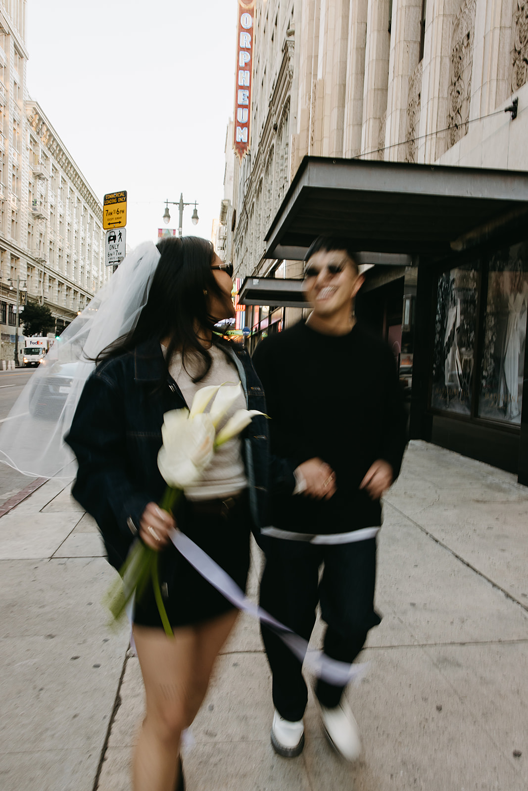 couple takes engagement photos on the street in downtown LA 