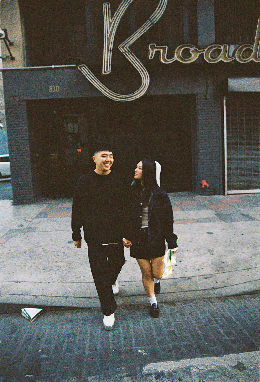 couple takes engagement photos on the street in downtown LA 