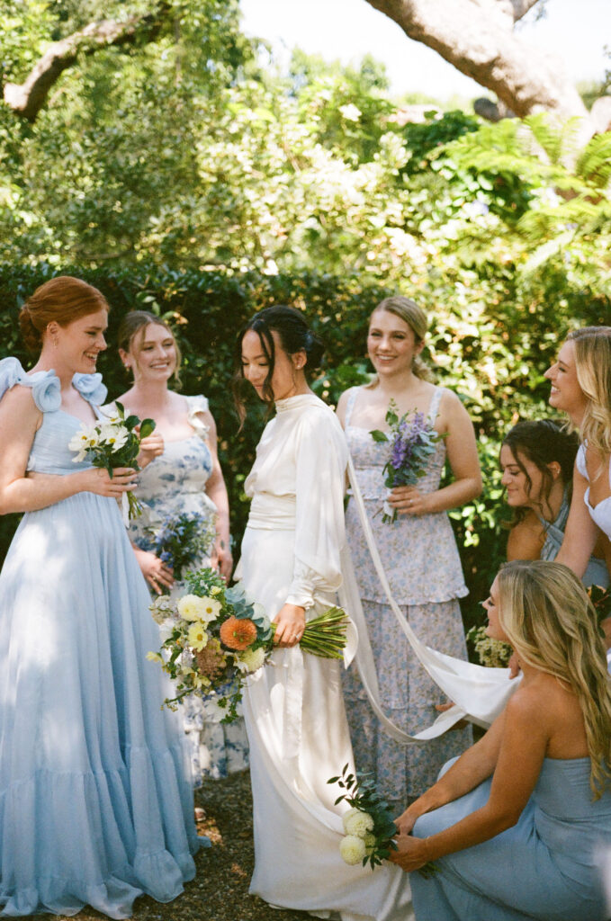 bridal party take their documentary style wedding photos outdoors