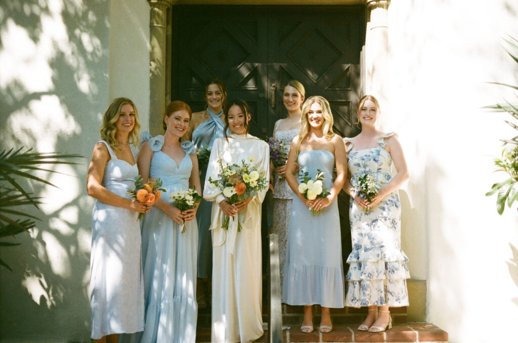 bridal party take their documentary style wedding photos outdoors