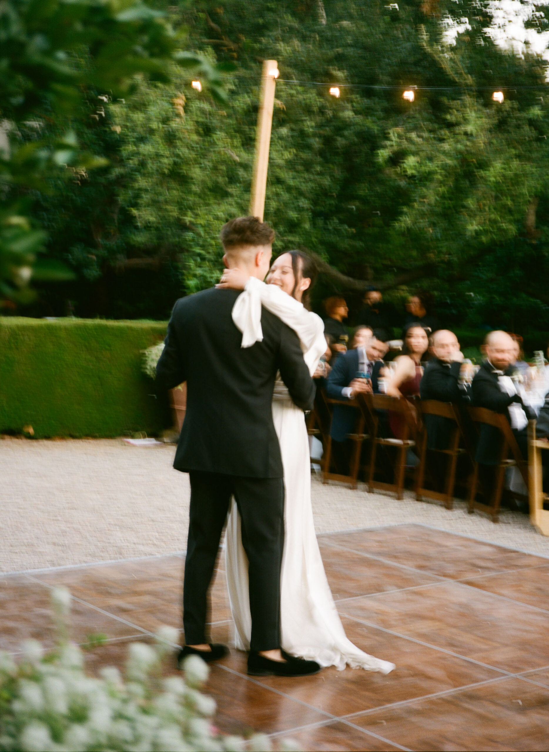 bride and groom dance and take their documentary style wedding photos outdoors